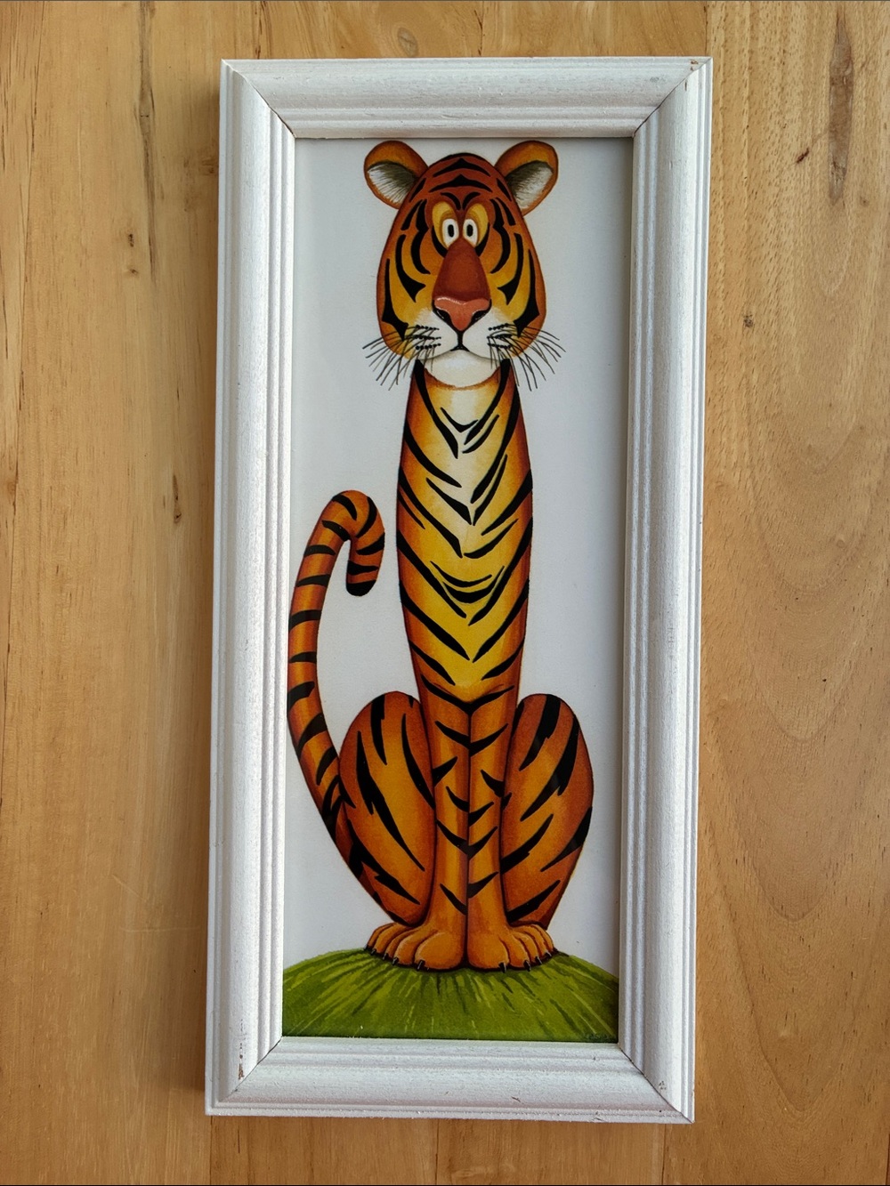 Whimsical Orange Tiger Wall Art in white frame about 11 x 5 inches